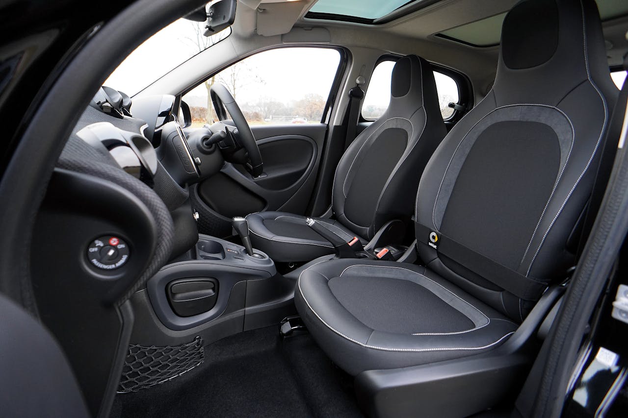 hero-img-02 Explore the sleek interior of a modern luxury car featuring leather seats and advanced technology.